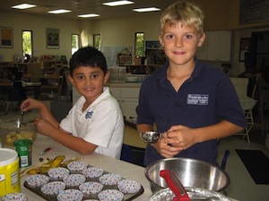 Elementary Students cooking.