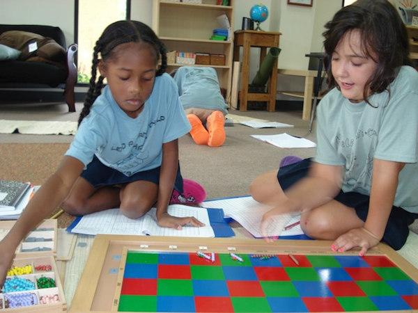 Elementary students working with the checkerboard.