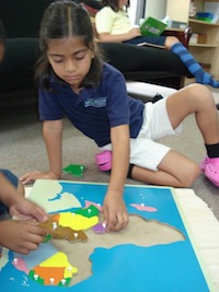 Elementary student working with 