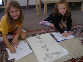 Elementary students perfecting their art techniques.